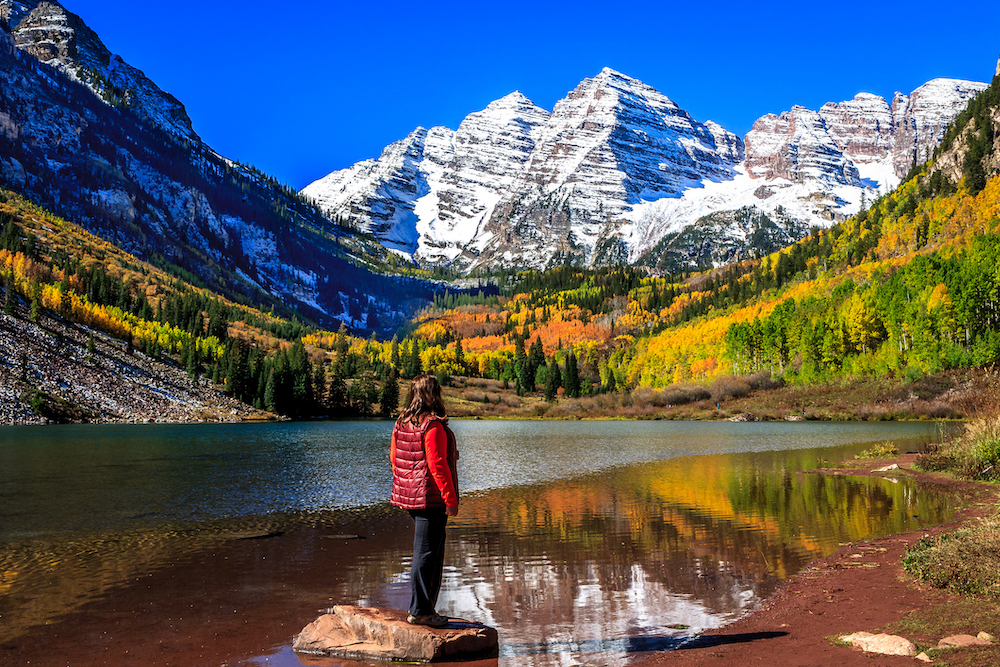 person hiking in aspen mountains