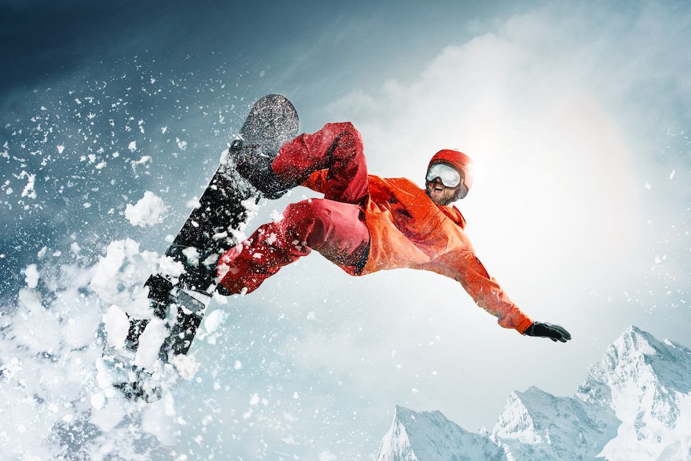 close up of snowboarder doing a jump