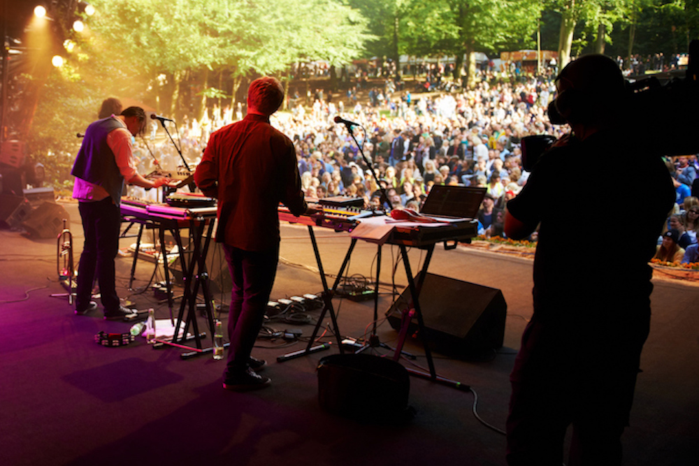 band on stage playing concert