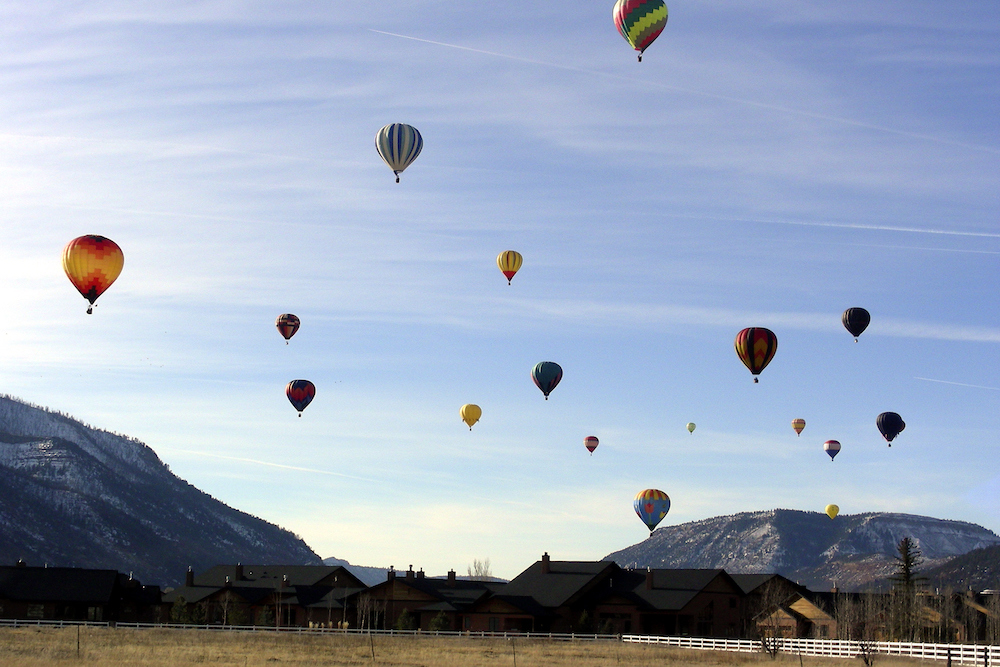 Hot air balloons against a blue sky