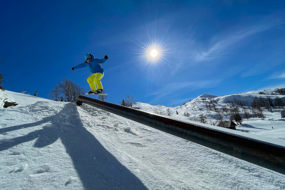 Snowboarder riding a rail